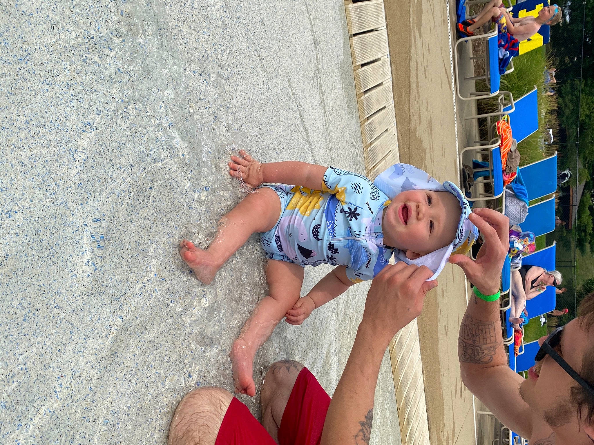 Dezmond is registered to the contest to win money with this photo: baby, baby_toddler_clothing, child, city, electric_blue, foot, fun, hand, happy, headwear, human_leg, leisure, person, play, recreation, sand, sandal, shorts, thigh, toddler
