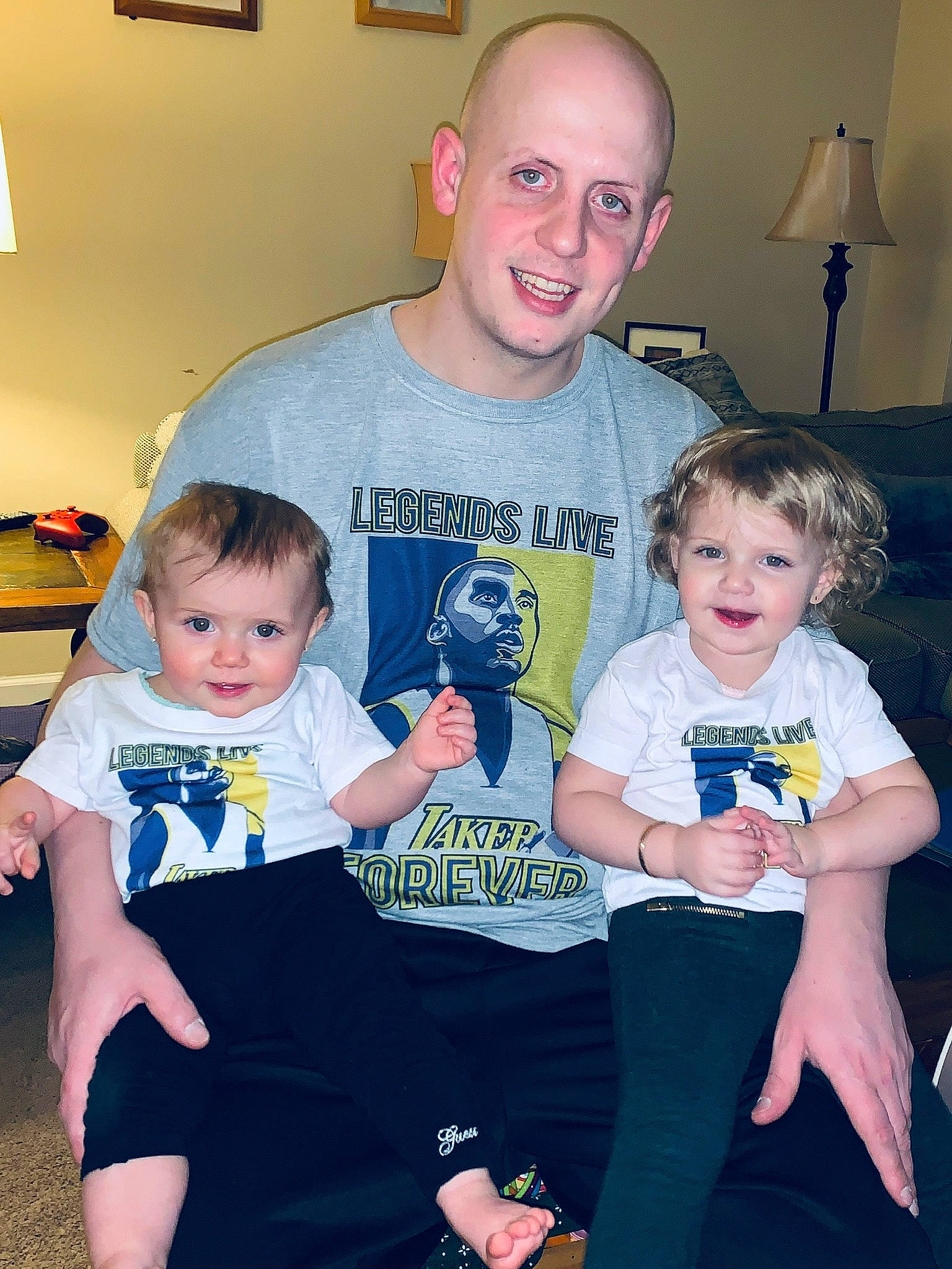 Amelia is registered to the contest to win money with this photo: baby, child, face, family, grandparent, head, iris, joy, lap, leg, people, person, room, sibling, sitting, skin, smile, t_shirt, toddler, vacation