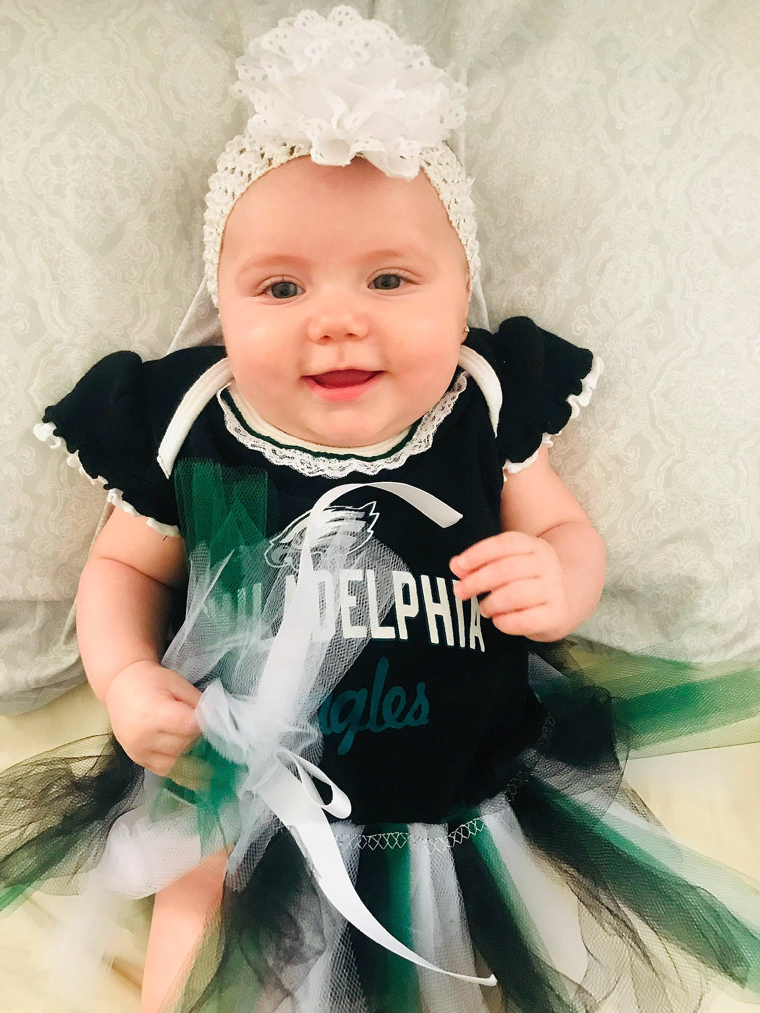 Amelia is registered to the contest to win money with this photo: baby, baby_products, baby_toddler_clothing, child, child_model, clothing, costume, costume_accessory, dress, fashion_accessory, formal_wear, hair_accessory, head, headgear, headpiece, headwear, outerwear, person, photography, product