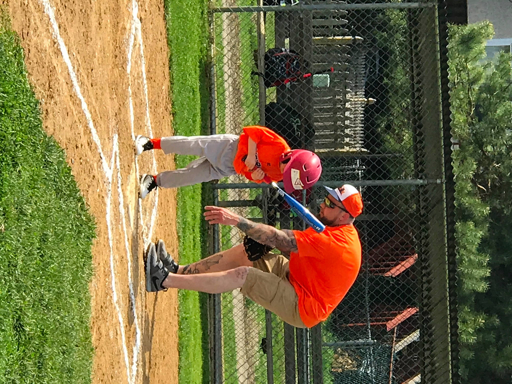 Irish Twins is registered to the contest to win money with this photo: adventure, college_baseball, competition, competition_event, extreme_sport, fun, grass, hat, headwear, helmet, leisure, line, mesh, net, person, player, recreation, sneakers, sports, sports_uniform