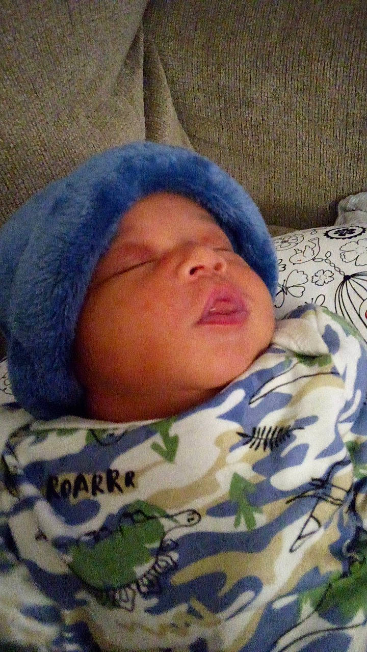 December joined the competition — help win amazing prizes! baby, baby_sleeping, beanie, bedding, bedtime, blanket, cheek, child, comfort, fur, hat, knit_cap, linens, military_camouflage, nap, pattern, person, room, sleep, textile