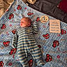 Tiberius joined the competition — help win amazing prizes! baby, bed, bedroom, blanket, blue, child, cozy, family_photo, infant, lying_down, milestone_card, newborn, nursery, one_month_old, onesie, peaceful, portrait, race_cars, sleeping, striped_clothing