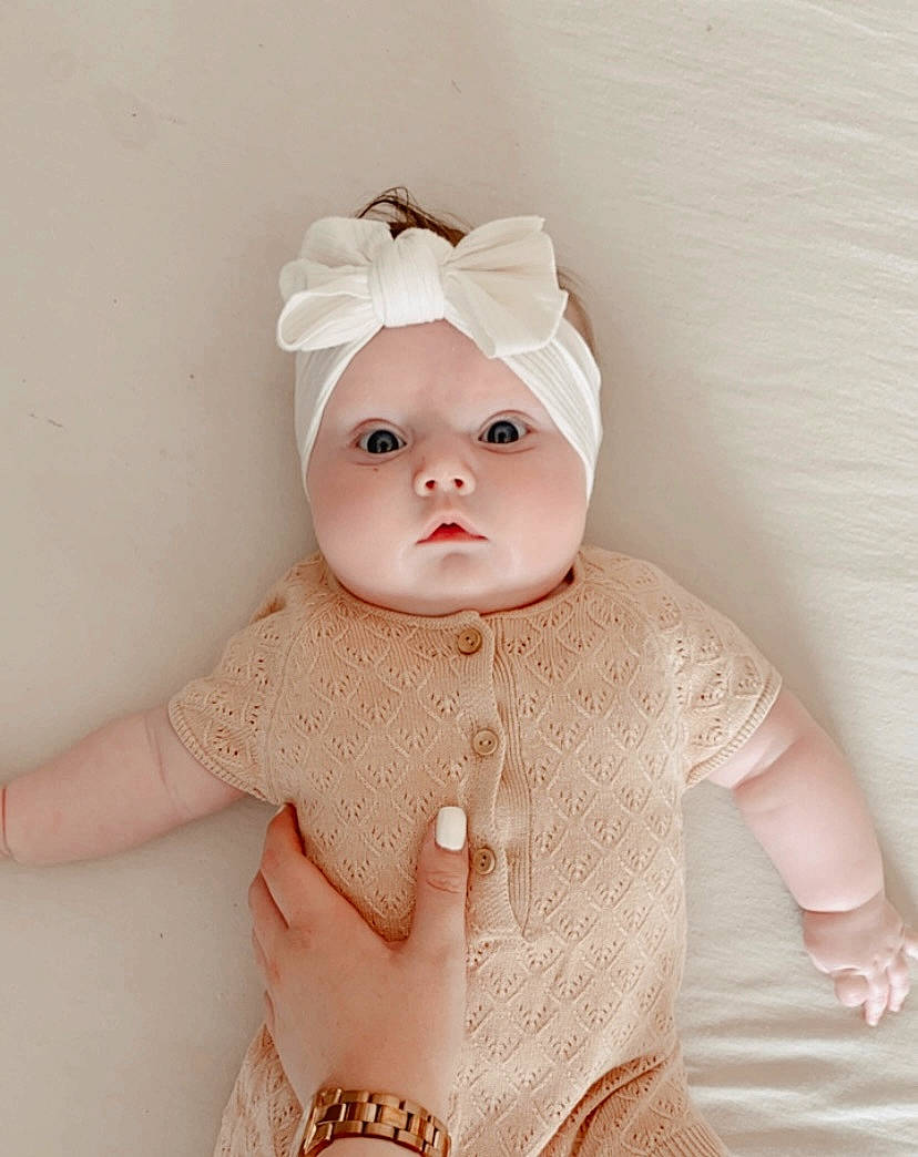 Billie participe au concours pour gagner de l'argent avec cette photo : art, baby, baby_toddler_clothing, cap, child, creative_arts, doll, dress, embellishment, fashion_accessory, finger, hand, head, headgear, human_body, pattern, peach, pink, sleeve, toy
