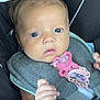 baby, infant, car_seat, pacifier, child, face, hand, clothing, seatbelt, closeup, skin, expression, cute, safety, newborn, young_child, indoor, portrait, person, pink