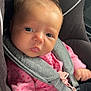 baby, car_seat, child, closeup, cute, expression, face, human, indoor, infant, newborn, person, pink_clothing, safety, seatbelt, sitting, small_person, straps, transportation, young_child