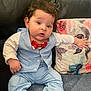 Leonidas joined the competition — help win amazing prizes! baby, child, suit, bow_tie, blue, couch, leather, pillow, floral, curly_hair, sitting, indoors, portrait, cute, infant, clothing, fashion, hand, foot, expression