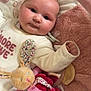 baby, infant, plush_toy, blanket, soft_toy, face, child, cute, cozy, indoors, lying_down, comfort, pink, white_clothing, pacifier, stuffed_animal, baby_girl, closeup, adorable, toddler