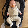 baby, baby_rocker, casual, child, comfort, cozy, cute, feet, flooring, homedecor, indoor, infant, knit_pants, pacifier, person, seated, star_pattern, vest, white_socks, wooden_floor