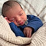Vicente is registered to the contest to win money with this photo: baby, newborn, sleeping, blanket, blue_clothing, infant, peaceful, closeup, soft_texture, wrapped, hand, face, skin, cozy, cute, resting, toddler, indoors, portrait, child