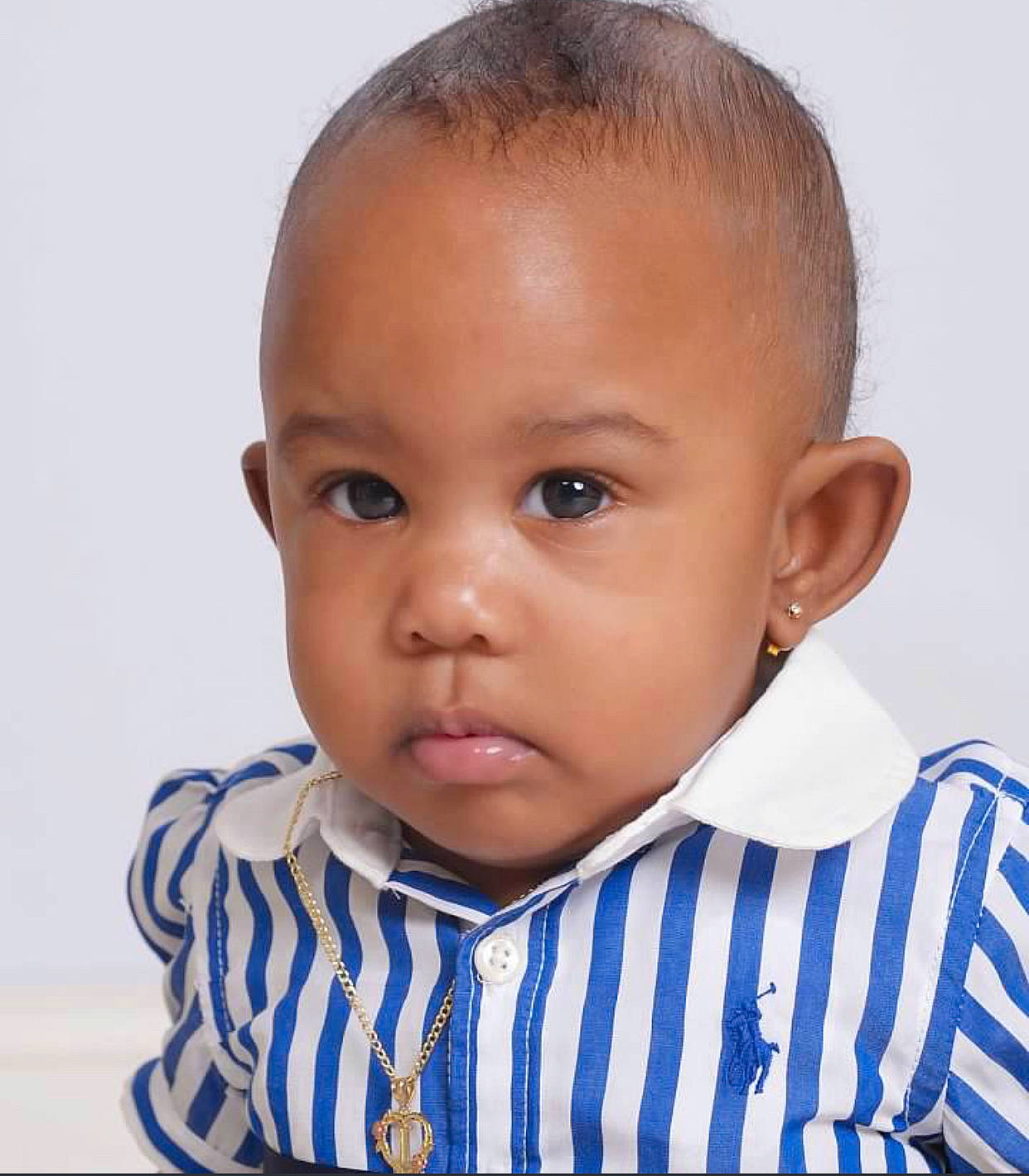 Iyanna is registered to the contest to win money with this photo: baby, baby_toddler_clothing, blue, buzz_cut, cheek, child, clothing, collar, ear, electric_blue, eyebrow, eyelash, forehead, happy, iris, no_expression, nose, person, sleeve, t_shirt