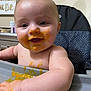 baby, high_chair, food, messy, smiling, face, hand, infant, child, indoor, feeding, cute, skin, table, expression, person, happy, young, mess, kitchen