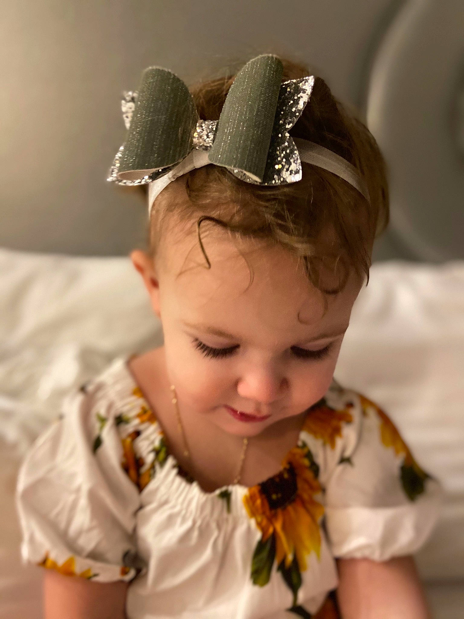 Alexa is registered to the contest to win money with this photo: baby, baby_toddler_clothing, bridal_accessory, cap, chin, costume_hat, ear, eye, eyebrow, eyelash, fashion_design, hair, hair_accessory, happy, head, headband, headpiece, jewellery, person, sleeve