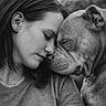 affection, animal, black_and_white, bond, calm, casual_clothing, closeup, dog, emotion, face, friendship, head, human, love, nature, outdoor, pet, portrait, short_hair, woman