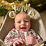 Côme a rejoint le concours — aidez-le/la à gagner de superbes lots ! baby, smiling, holiday, christmas, pajamas, reindeer_ears, infant, seat, face, happy, cute, festive, decorations, lights, indoors, child, portrait, christmas_tree, cozy, winter_clothing