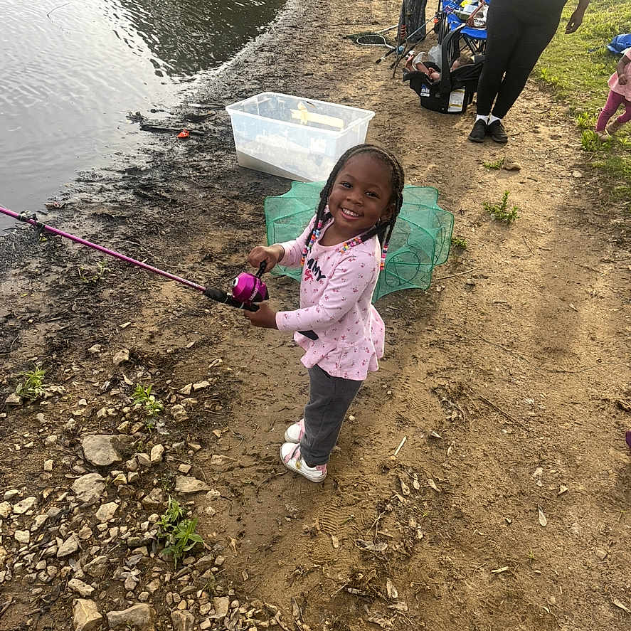 Enai joined the competition — help win amazing prizes! adult, braided_hair, child, dirt_path, fishing, fishing_rod, girl, grass, happy, muddy_shore, nature, outdoor, people, plastic_container, pond, recreation, rocks, smiling, sunny_day, water
