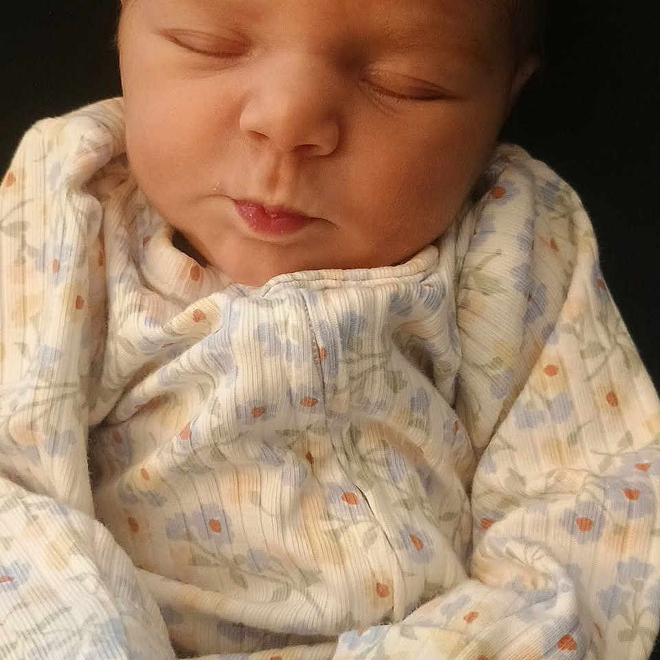 Mazie joined the competition — help win amazing prizes! newborn, baby, sleeping, infant, onesie, clothing, cute, peaceful, portrait, closeup, person, child, soft, cozy, small, face, hands, rest, quiet, indoors