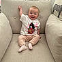 Amelia joined the competition — help win amazing prizes! baby, child, smiling, sitting, armchair, beige, tshirt, pants, sock, indoor, face, happy, cute, home, window, cushion, person, furniture, light, cozy