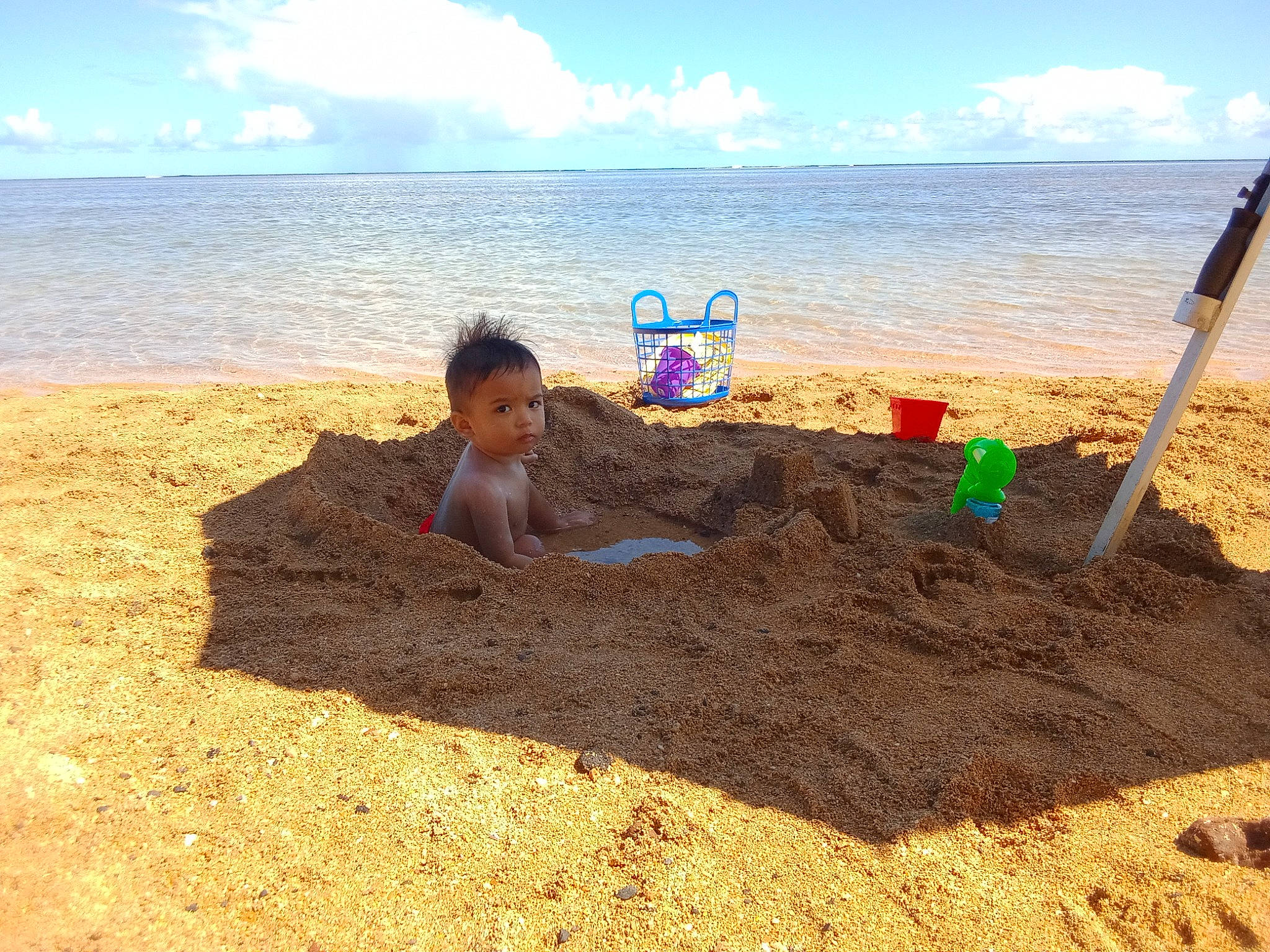 Kade joined the competition — help win amazing prizes! beach, body_of_water, building_sand_castles, cloud, coast, coastal_and_oceanic_landforms, fun, horizon, landscape, leisure, people_in_nature, people_on_beach, person, sand, shore, sky, toddler, travel, water, wind_wave