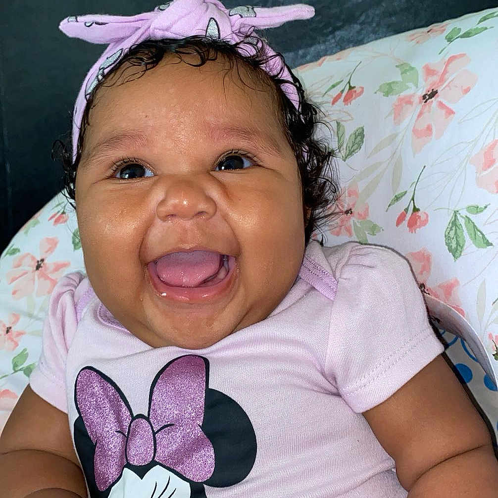 Lariah joined the competition — help win amazing prizes! accessories, baby, babylaughing, bodypart, clothing, cushion, face, furniture, happy, hat, head, homedecor, laughing, mouth, person, photography, portrait, smile, t_shirt, teeth