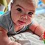 Enzo joined the competition — help win amazing prizes! baby, infant, face, tongue, eyes, hand, arm, quilt, blanket, clothing, cute, child, portrait, indoor, soft, skin, expression, closeup, person, playful