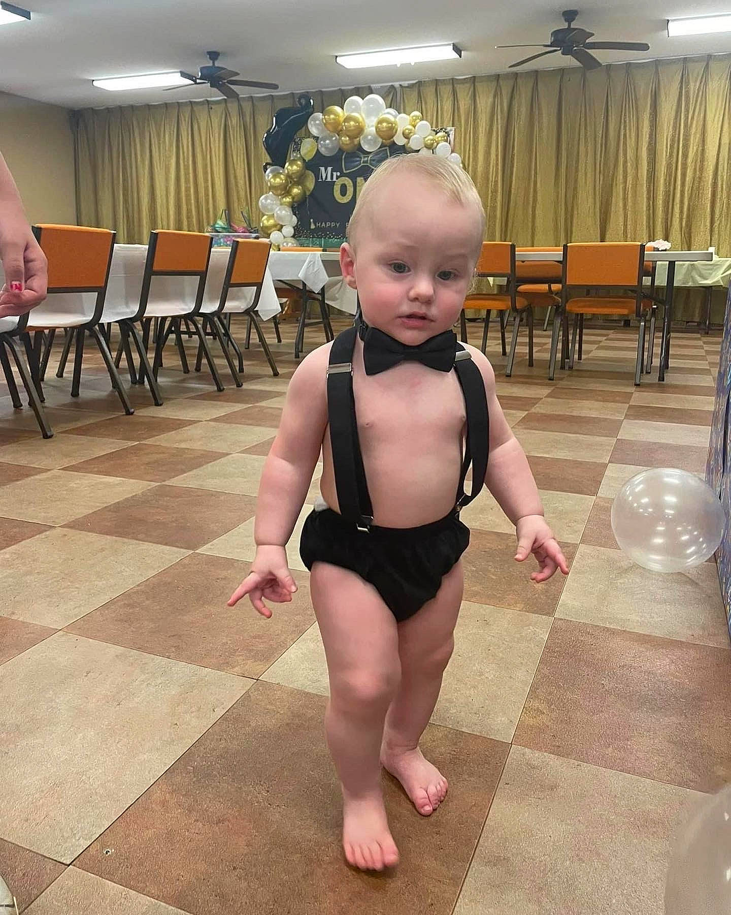 Lennox joined the competition — help win amazing prizes! baby, baby_toddler_clothing, barefoot, chair, event, floor, flooring, fun, hardwood, human_leg, joint, knee, leisure, monokini, performing_arts, person, sportswear, table, thigh, toddler