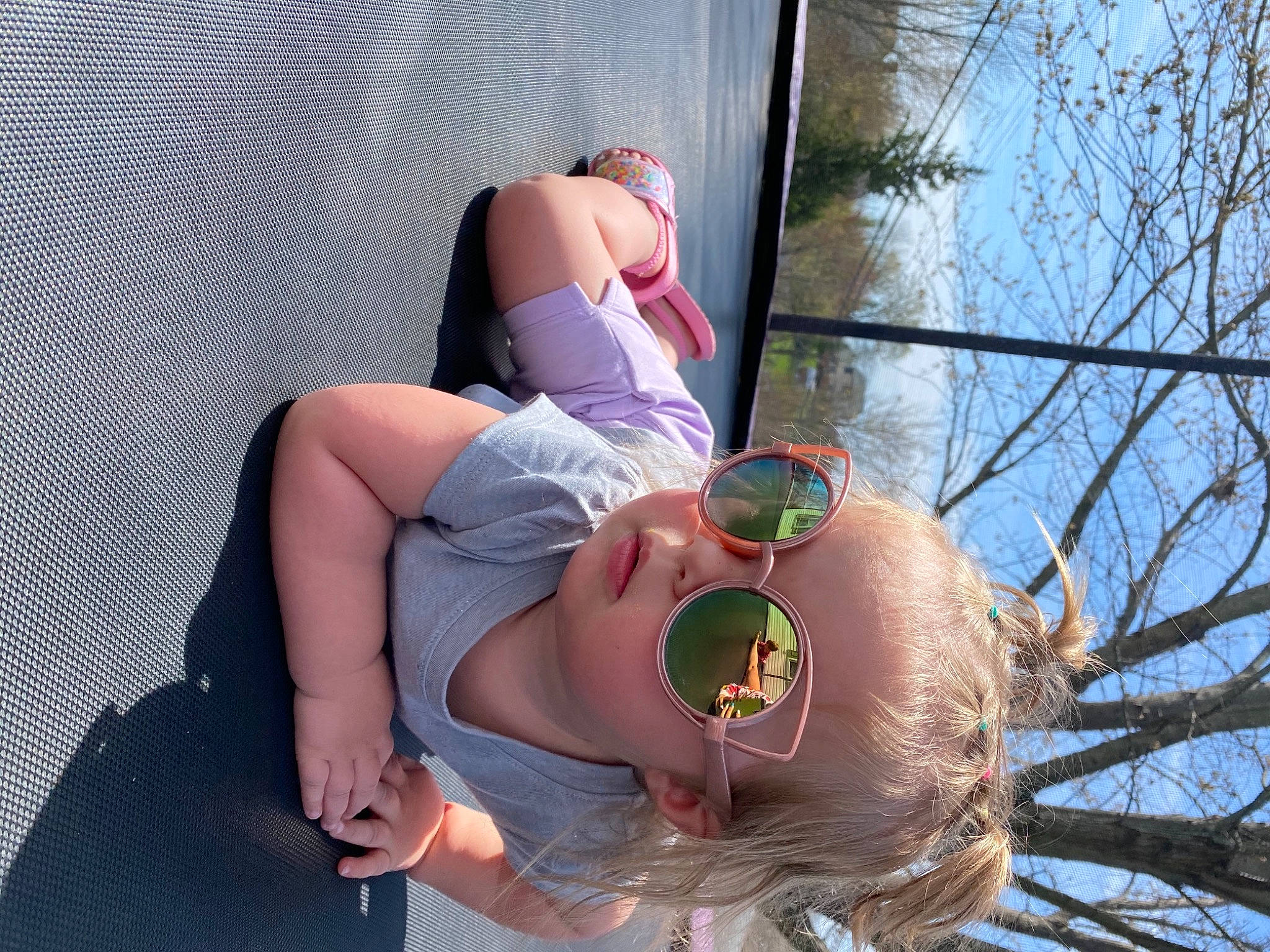Everleigh joined the competition — help win amazing prizes! elbow, eyewear, fun, fur, happy, hat, human_leg, knee, leg, leisure, long_hair, person, sandal, shorts, sitting, sky, sun_hat, thigh, tree