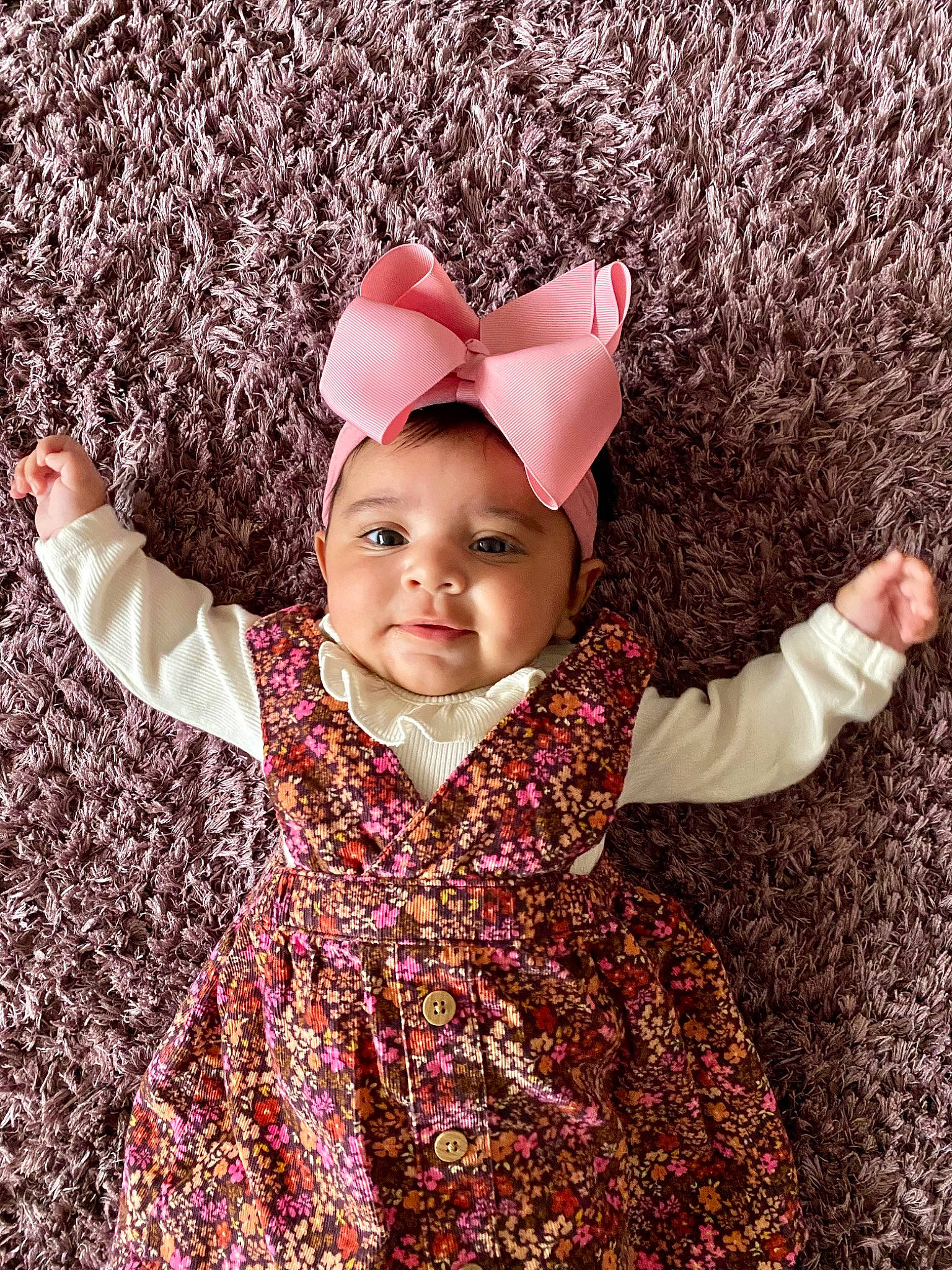 Amar joined the competition — help win amazing prizes! baby, baby_toddler_clothing, cap, child, finger, gesture, grass, happy, headband, headpiece, headwear, leaf, magenta, pattern, people_in_nature, person, petal, pink, skin, sleeve