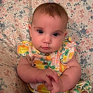 Riverlynn joined the competition — help win amazing prizes! baby, infant, child, portrait, cute, floral, dress, pattern, hands, face, eyes, skin, person, sitting, indoors, young, plush, soft, background, colorful