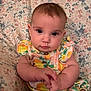 baby, infant, child, portrait, cute, floral, dress, pattern, hands, face, eyes, skin, person, sitting, indoors, young, plush, soft, background, colorful