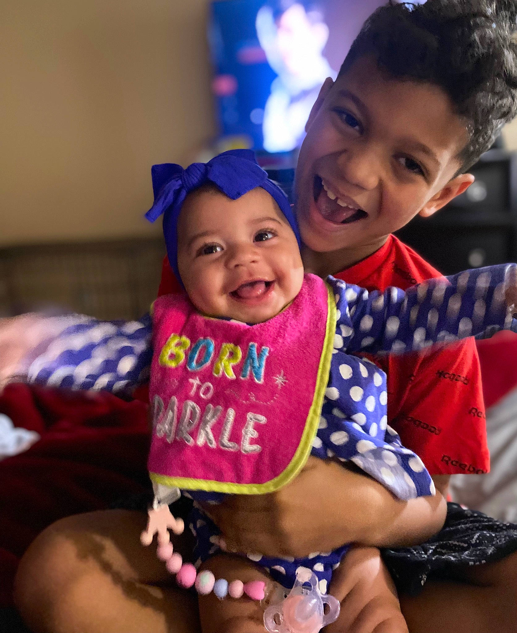 Kalia is registered to the contest to win money with this photo: baby_toddler_clothing, child, cool, facial_expression, finger, fun, gesture, hand, happy, hat, head, headwear, human, joy, mammal, organ, person, pink, skin, smile