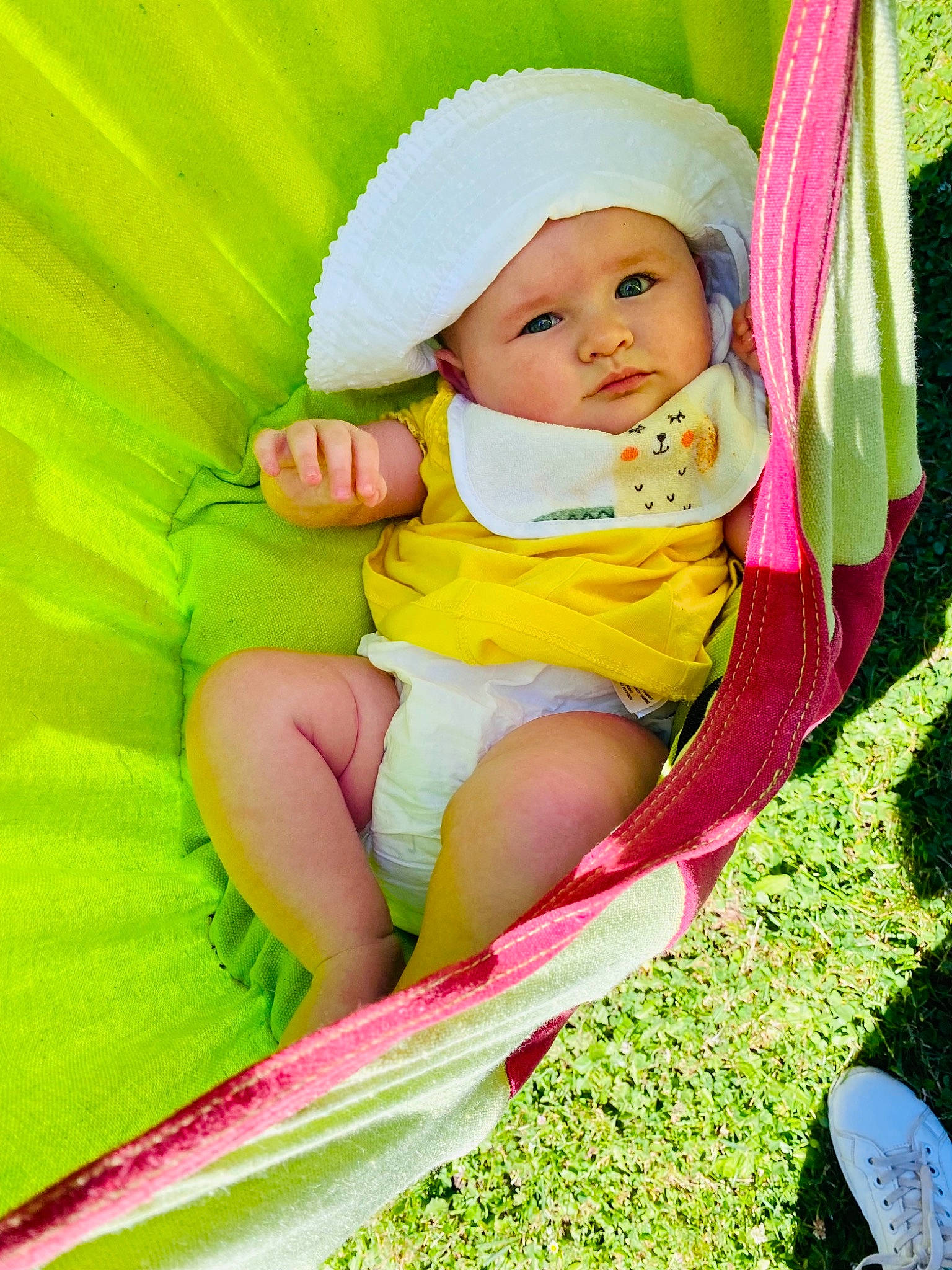 Ellie participe au concours pour gagner de l'argent avec cette photo : baby, baby_toddler_clothing, chair, child, comfort, eye, facial_expression, grass, green, happy, head, headwear, human_body, leaf, leisure, magenta, people_in_nature, person, pink, product