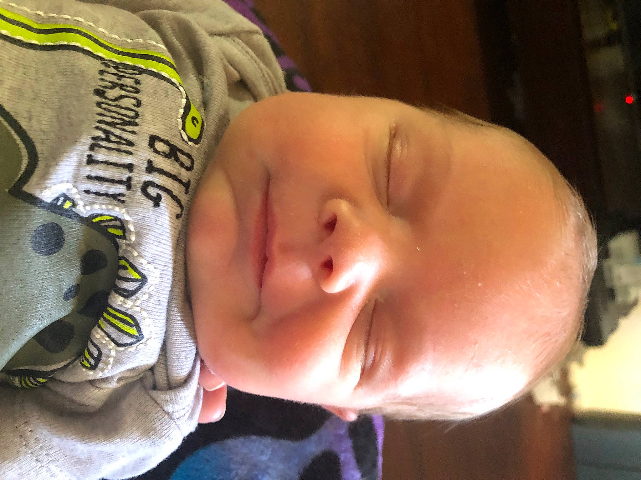 Mikael is registered to the contest to win money with this photo: baby, baby_toddler_clothing, cheek, child, comfort, ear, eye, eyelash, forehead, happy, headgear, jaw, lip, mouth, neck, nose, person, room, skin, sleeve