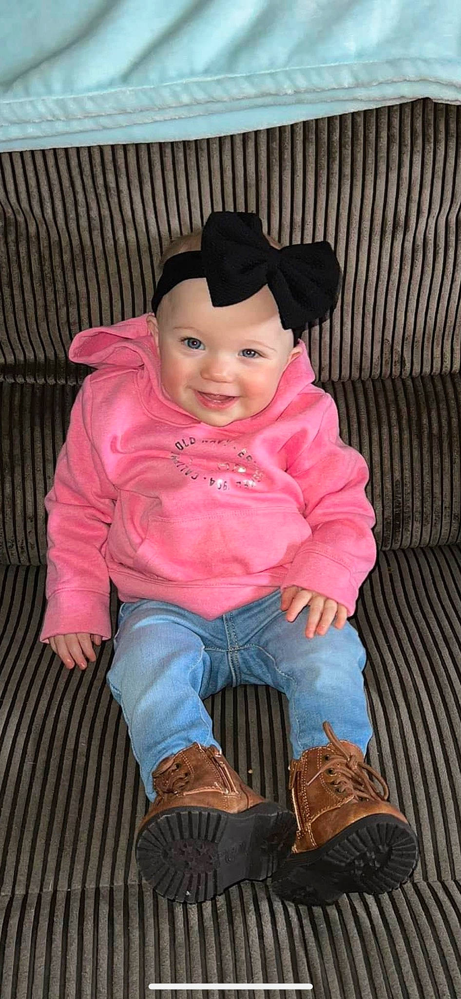 Lilliana joined the competition — help win amazing prizes! baby_toddler_clothing, black, cap, cheek, clothing, face, happy, headwear, jacket, jeans, joy, lip, magenta, nose, organ, person, pink, sitting, skin, sleeve