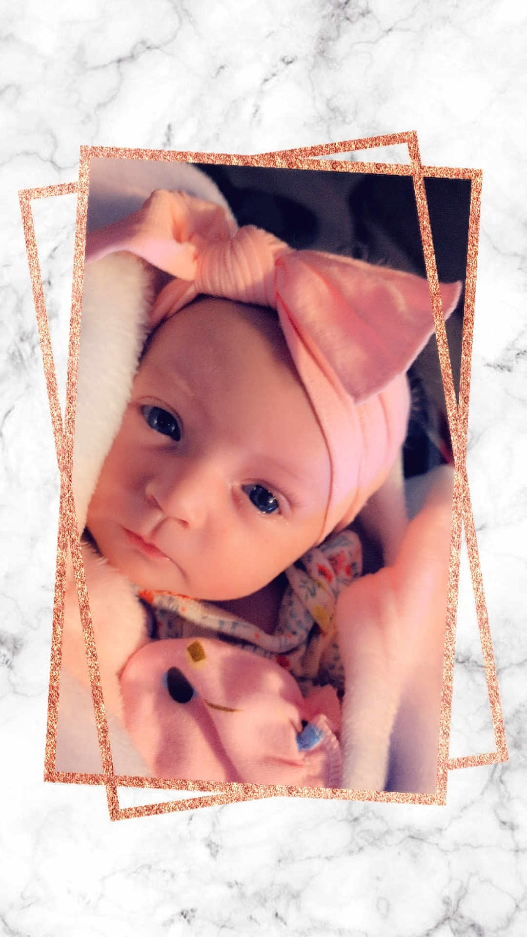 Jessie is registered to the contest to win money with this photo: baby, blanket, bow, child, closeup, cute, expression, eyes, face, frame, headband, indoors, infant, marble, newborn, pink, portrait, soft, warm, wrapped
