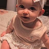 Jessie joined the competition — help win amazing prizes! baby, child, infant, headband, bow, dress, cherry, cute, smile, face, eyes, skin, sitting, bed, blanket, indoors, clothing, person, adorable, young