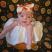 Kyra-Mae joined the competition — help win amazing prizes! baby, infant, pumpkin, headband, halloween, costume, white_clothing, decorative_background, jack_o_lantern, orange, cute, portrait, child, holiday_theme, festive, smiling, indoors, face, celebration, seasonal