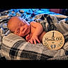 baby, newborn, sleeping, infant, portrait, blanket, plaid, milestone, one_month_old, cozy, indoors, close_up, face, closed_eyes, peaceful, lying_down, child, photography, round_card, soft_lighting