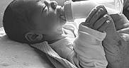 Havick joined the competition — help win amazing prizes! newborn, baby, infant, bottle, feeding, milk, sleepy, lying_down, blanket, swaddled, hands, face, portrait, black_and_white, monochrome, indoor, soft_light, close_up, clothing, resting