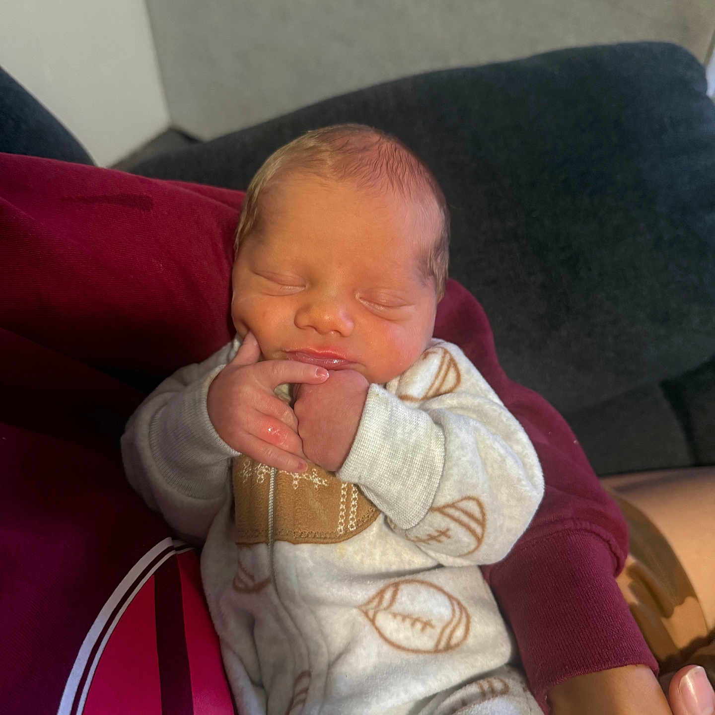 Havick is registered to the contest to win money with this photo: newborn, baby, sleeping, infant, portrait, face, hands, arms, onesie, clothing, blanket, adult, holding, couch, indoor, home, cozy, peaceful, closeup, family