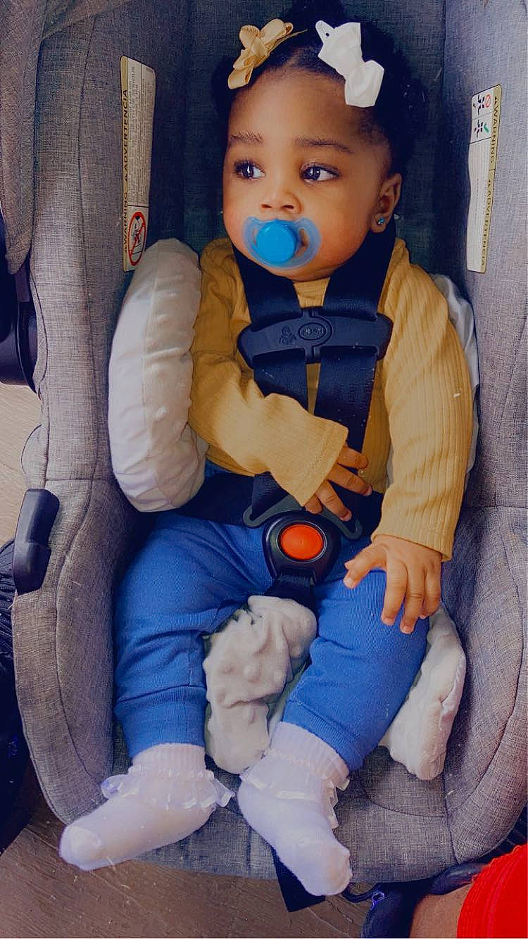 Faith is registered to the contest to win money with this photo: baby, baby_carriage, baby_toddler_clothing, car_seat, cheek, comfort, cool, eye, face, finger, hand, hat, head, person, product, skin, sleeve, thumb, toddler, wheel