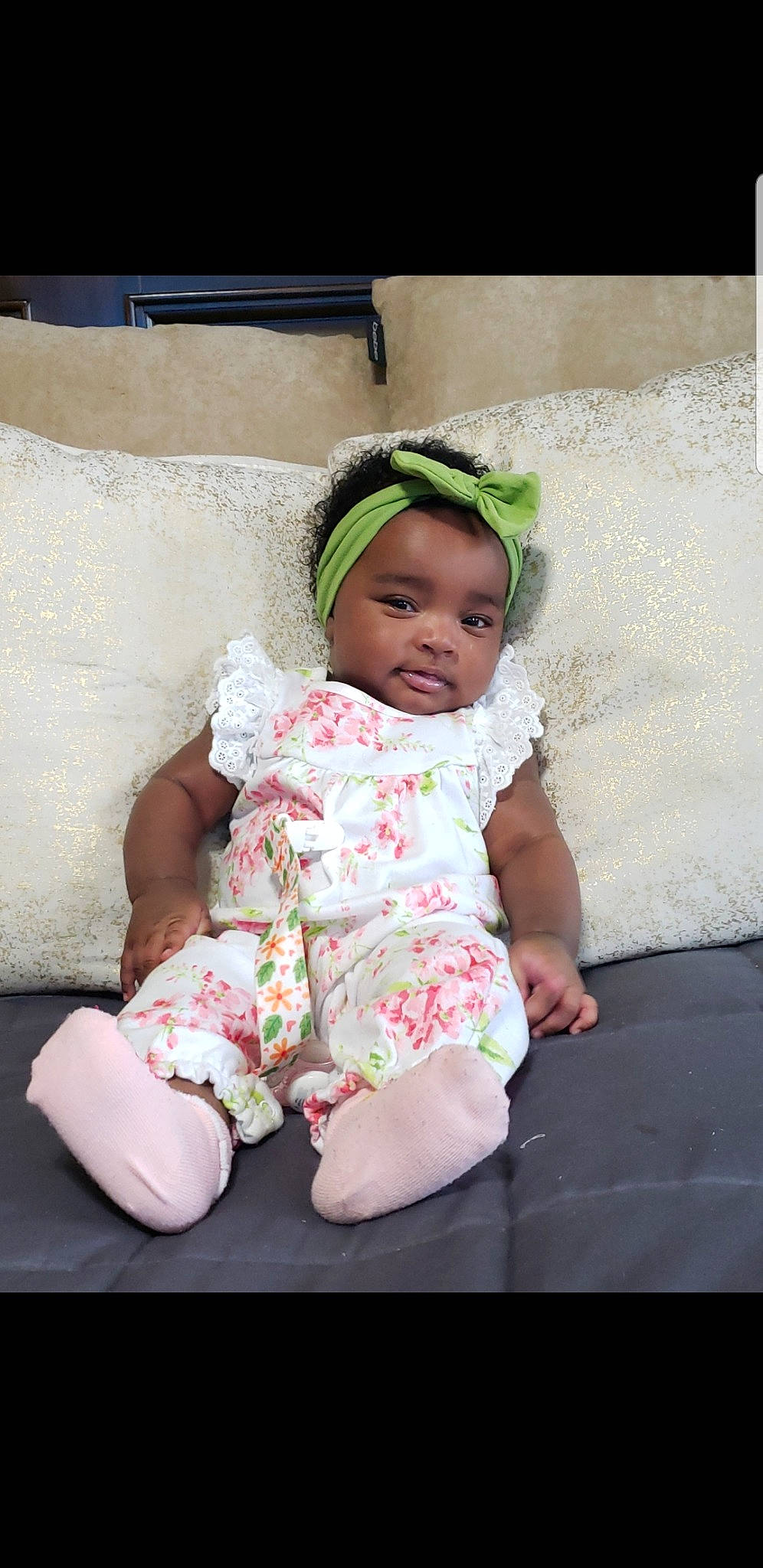 Alaya is registered to the contest to win money with this photo: baby, baby_products, baby_toddler_clothing, cheek, child, hair_accessory, headgear, headwear, person, pink, product, sitting, smile, toddler