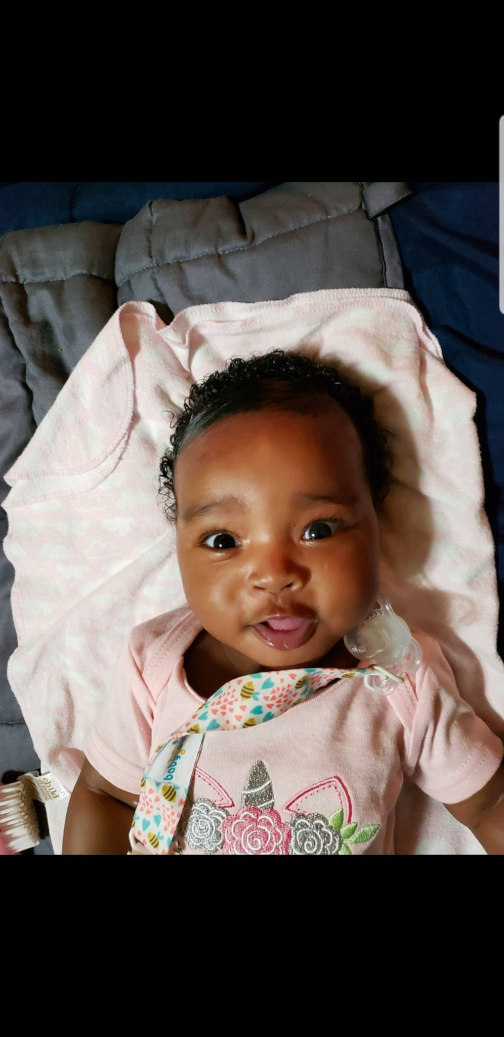 Alaya is registered to the contest to win money with this photo: baby, black_hair, cheek, child, eye, face, forehead, gesture, head, human, iris, lip, nose, person, photography, skin, smile, toddler