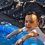 toddler, child, smiling, pool, water, blue, outdoor, sunlight, shadow, tree, leaves, summer, play, happy, splashing, inflatable, clothing, person, face, daylight