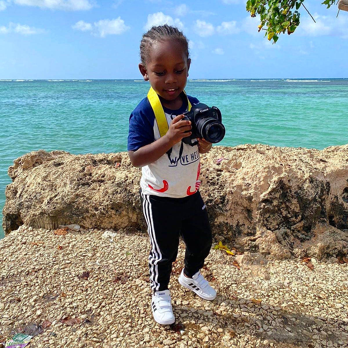Zaine joined the competition — help win amazing prizes! active_pants, beach, child, coast, coastal_and_oceanic_landforms, holiday, human_body, leggings, ocean, people_in_nature, person, physical_fitness, sea, shoe, shore, sneakers, summer, sweatpant, toddler, tropics