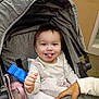 Eyliia joined the competition — help win amazing prizes! baby, infant, stroller, smiling, tongue_out, baby_bottle, blanket, hand, nail_polish, canopy, hood, indoors, portrait, cute, happy, toy, seat, clothing, door, carpet