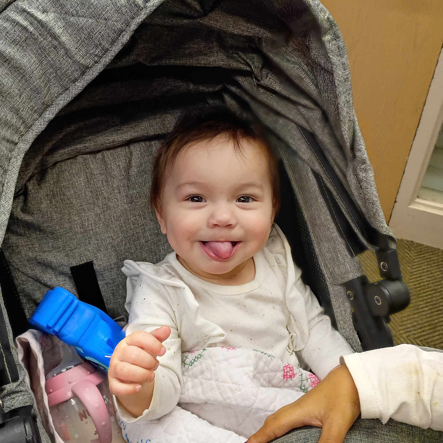 Eyliia joined the competition — help win amazing prizes! baby, baby_bottle, blanket, canopy, carpet, clothing, cute, door, hand, happy, hood, indoors, infant, nail_polish, portrait, seat, smiling, stroller, tongue_out, toy
