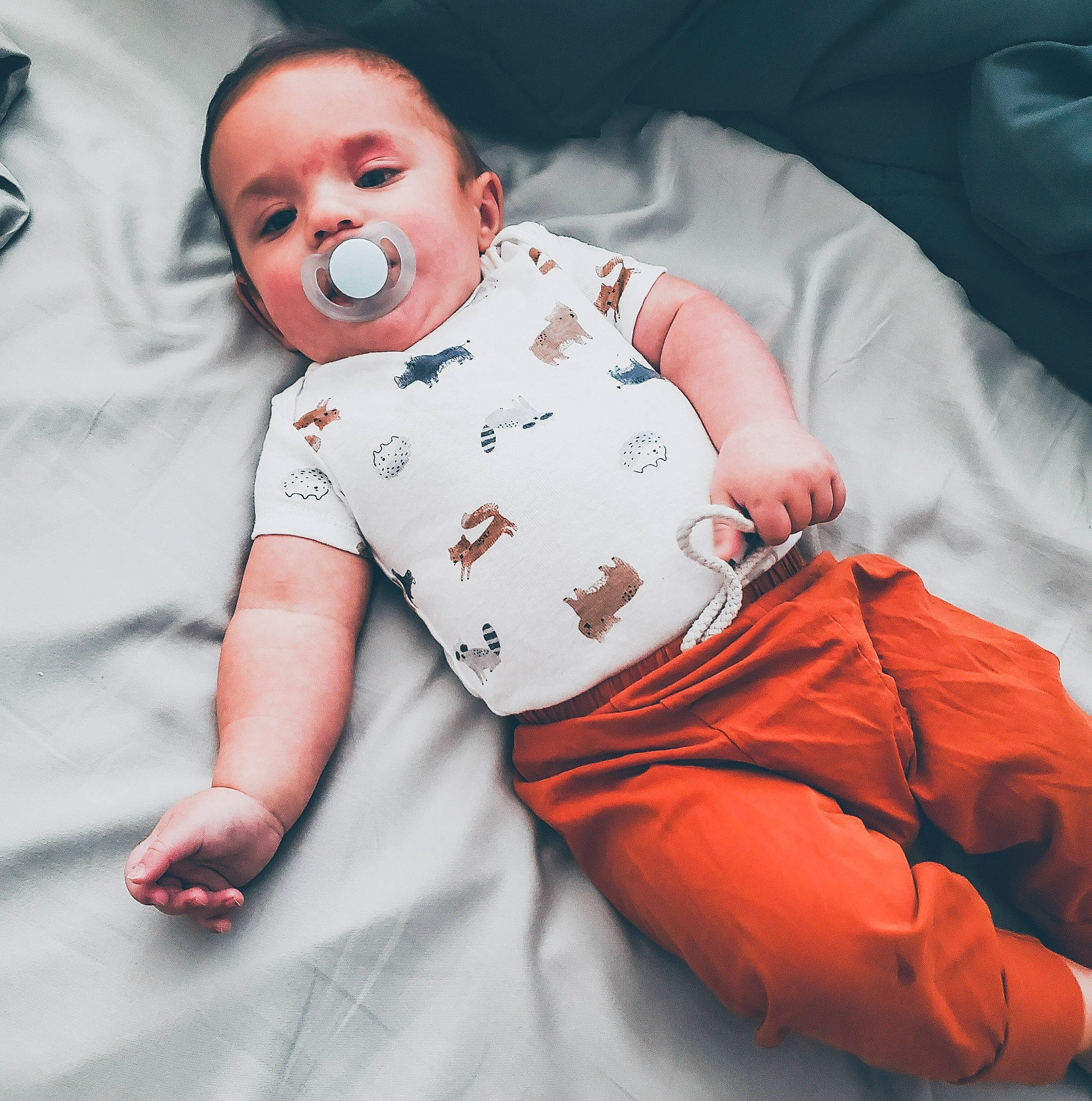 Riley joined the competition — help win amazing prizes! baby, baby_products, baby_safety, baby_sleeping, baby_toddler_clothing, carmine, cheek, child, comfort, face, fun, happy, head, infant_bodysuit, linens, pattern, person, sitting, sleeve, t_shirt