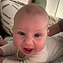 Riley-James is registered to the contest to win money with this photo: baby, smiling, face, eyes, infant, lying_down, bedspread, pillow, white_clothing, happy, closeup, skin, child, room, indoors, person, cute, expression, young, head