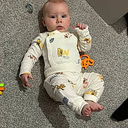 Riley-James joined the competition — help win amazing prizes! baby, carpet, child, clothing, cute, expression, face, feet, floor, hand, indoors, infant, lying_down, pacifier, pajamas, person, rattle, soft, toy, winnie_the_pooh