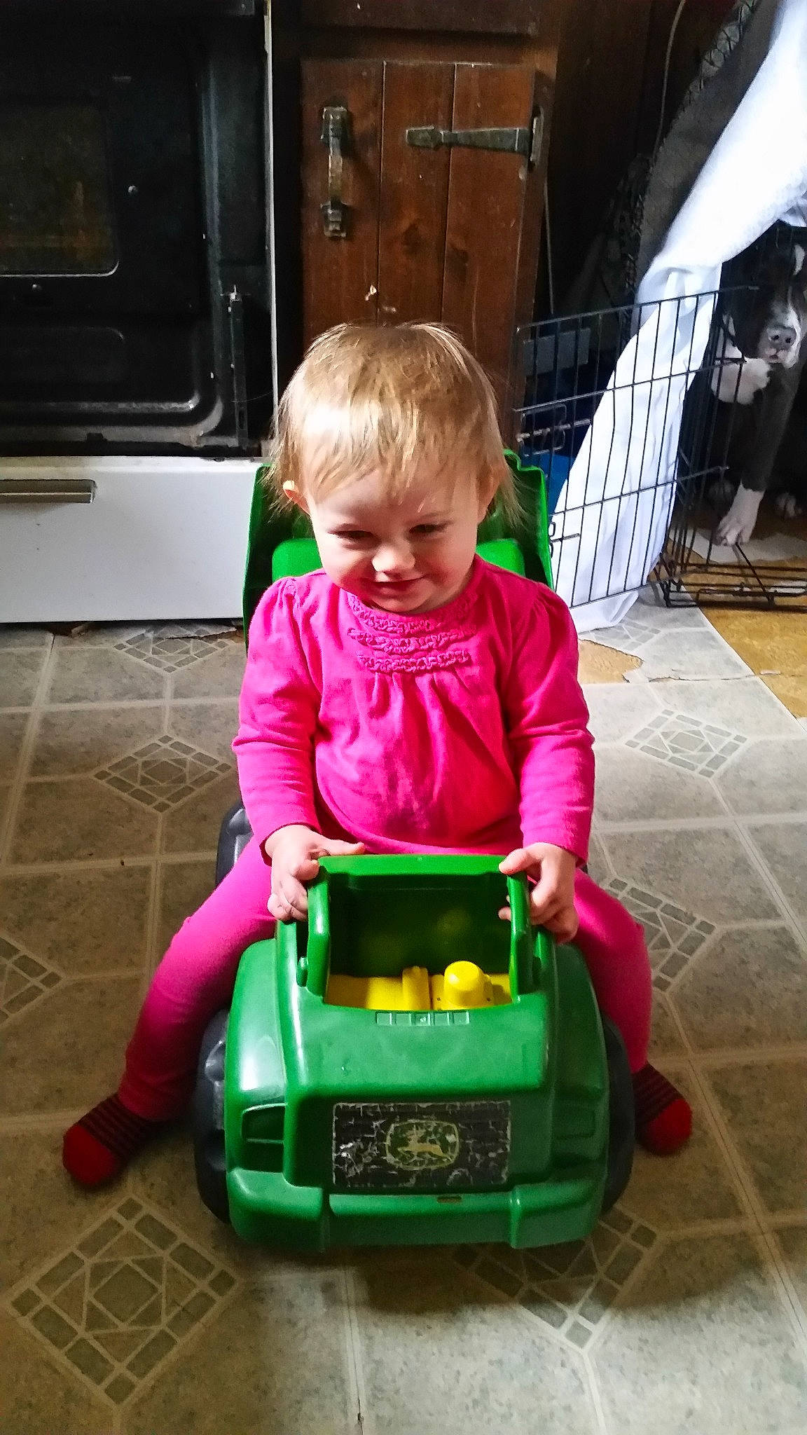 Marthua Carles is registered to the contest to win money with this photo: car, child, day, fun, green, infant, joy, person, play, product, sitting, toddler, toy